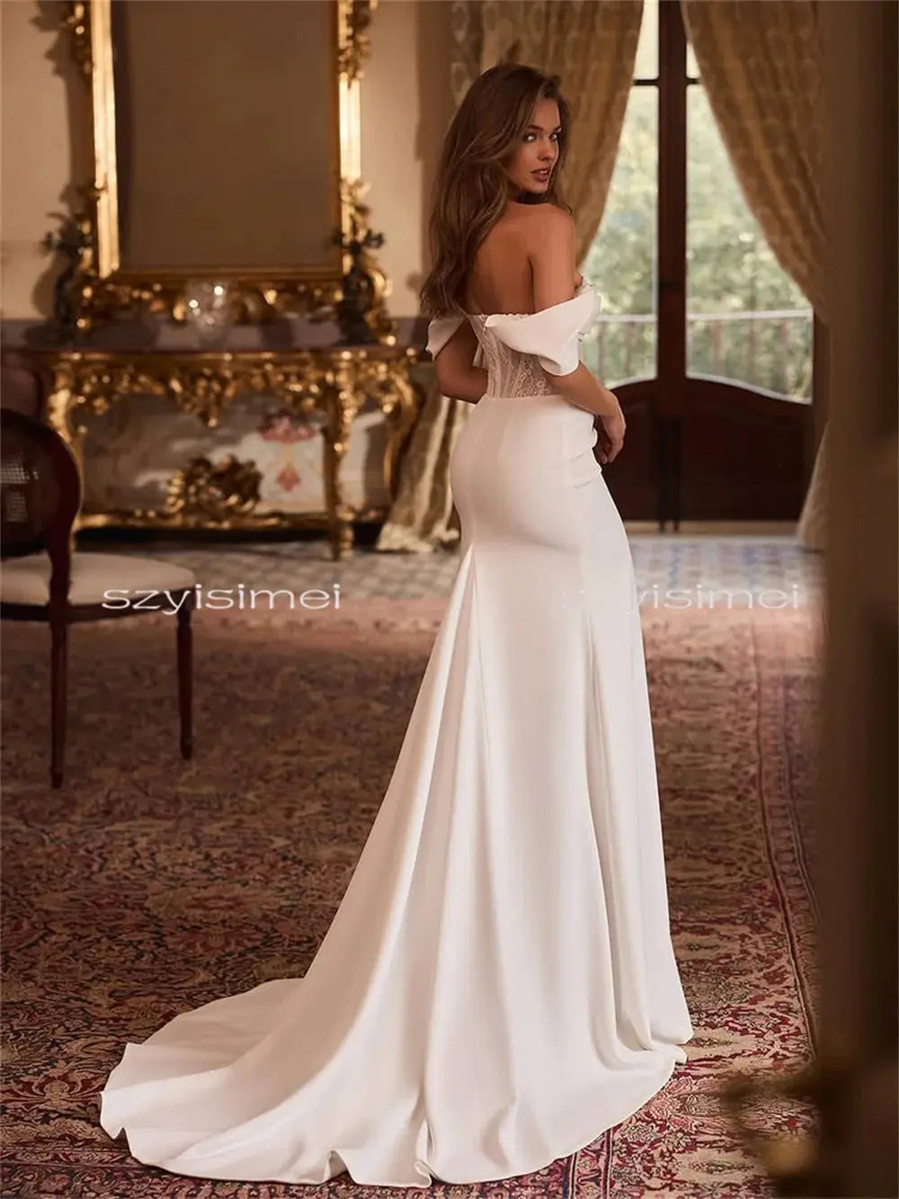 Romantic satin wedding dress with delicate lace decorations and a dramatic profile.