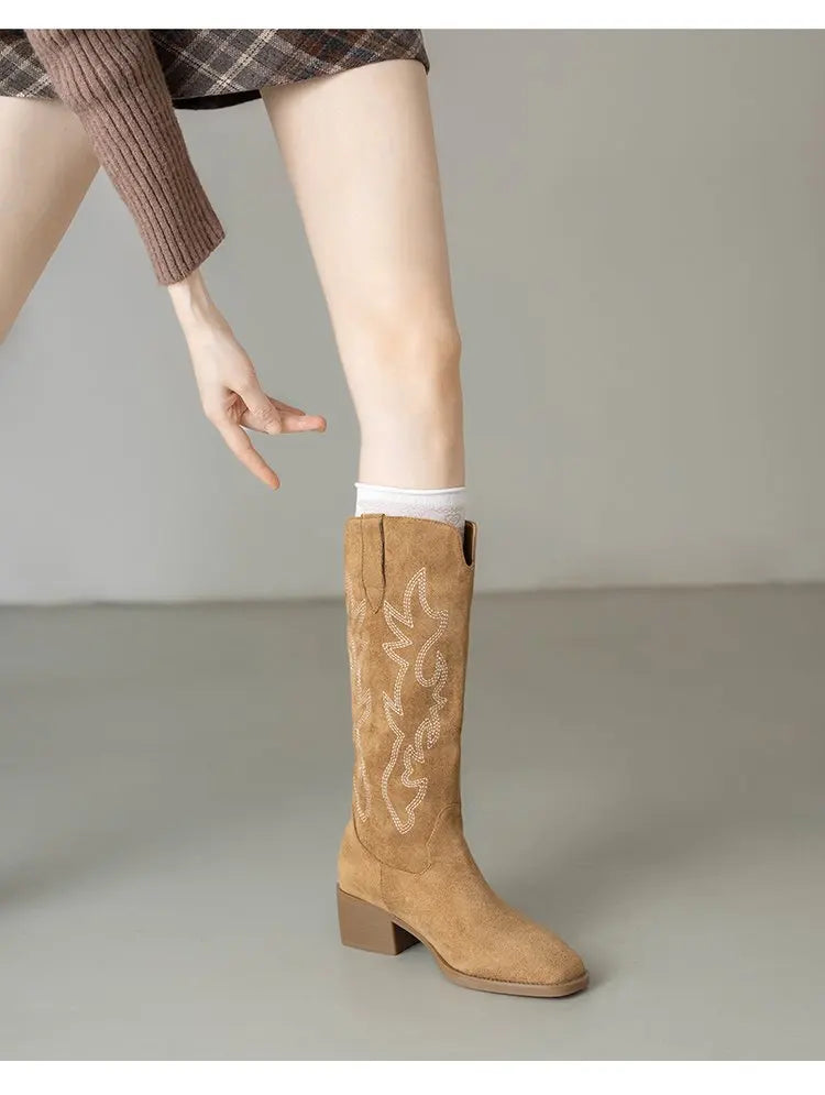 Women's Western boots with knee-high silhouette and slip-on entry
