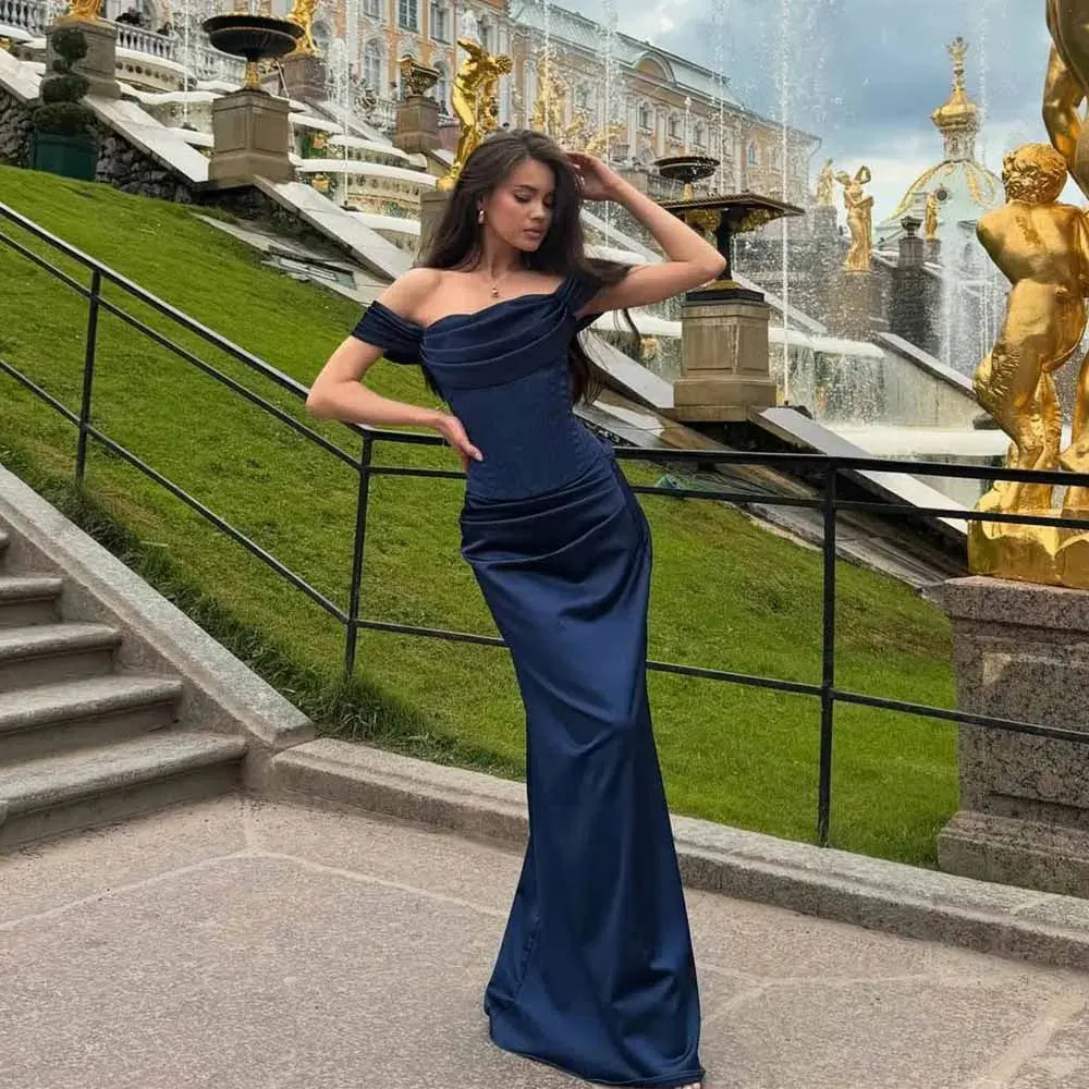 Midnight Elegance gown in navy blue satin with off-shoulder neckline.