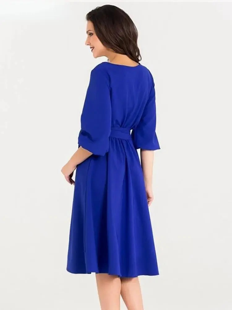 Sophisticated A-line dress in a striking green hue, perfect for garden parties.