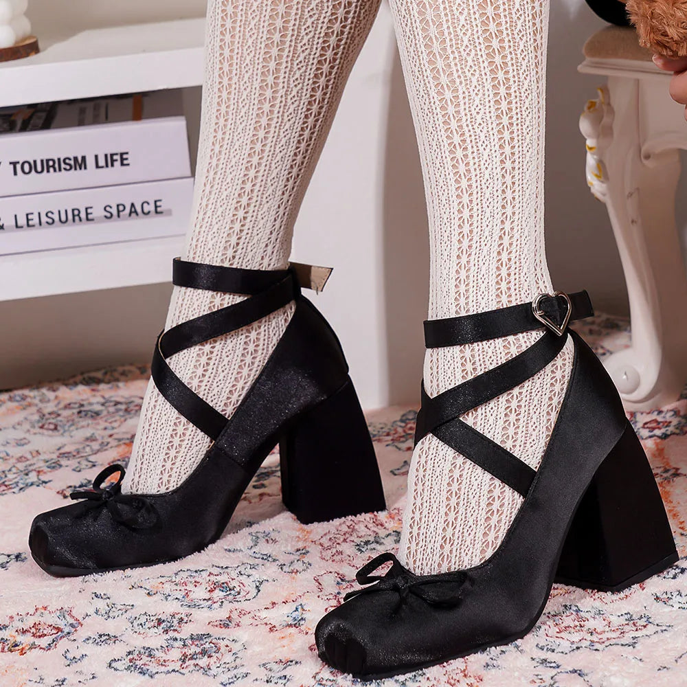 Back view of blush satin heels highlighting the block heel design.