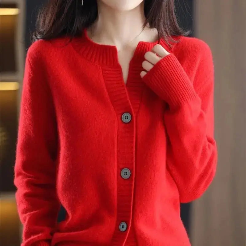Winter's Warm Embrace cardigan draped elegantly on a chair.