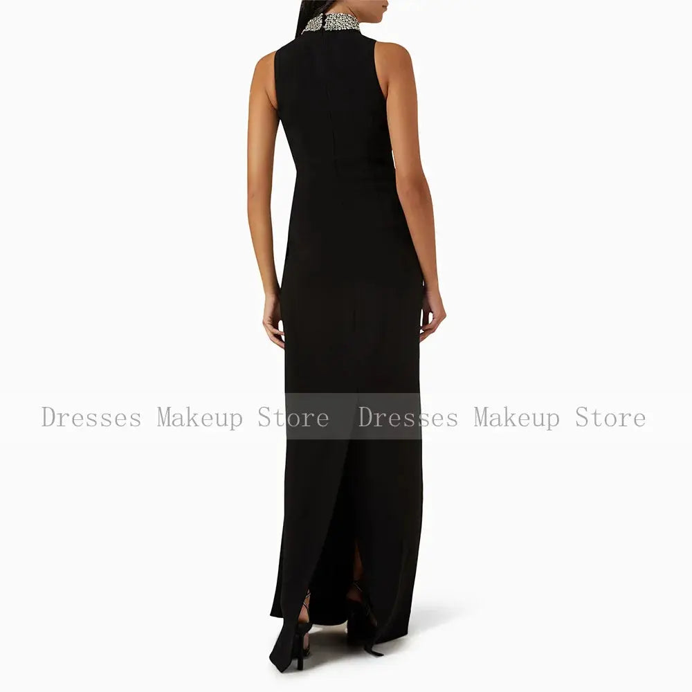 Elegant sleeveless design of the Midnight Sparkle Gown featuring a high collar and ruched jersey fabric.