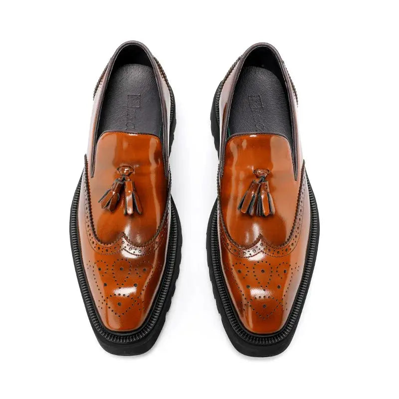 Timeless tassel detail on luxury loafers for discerning gentlemen.