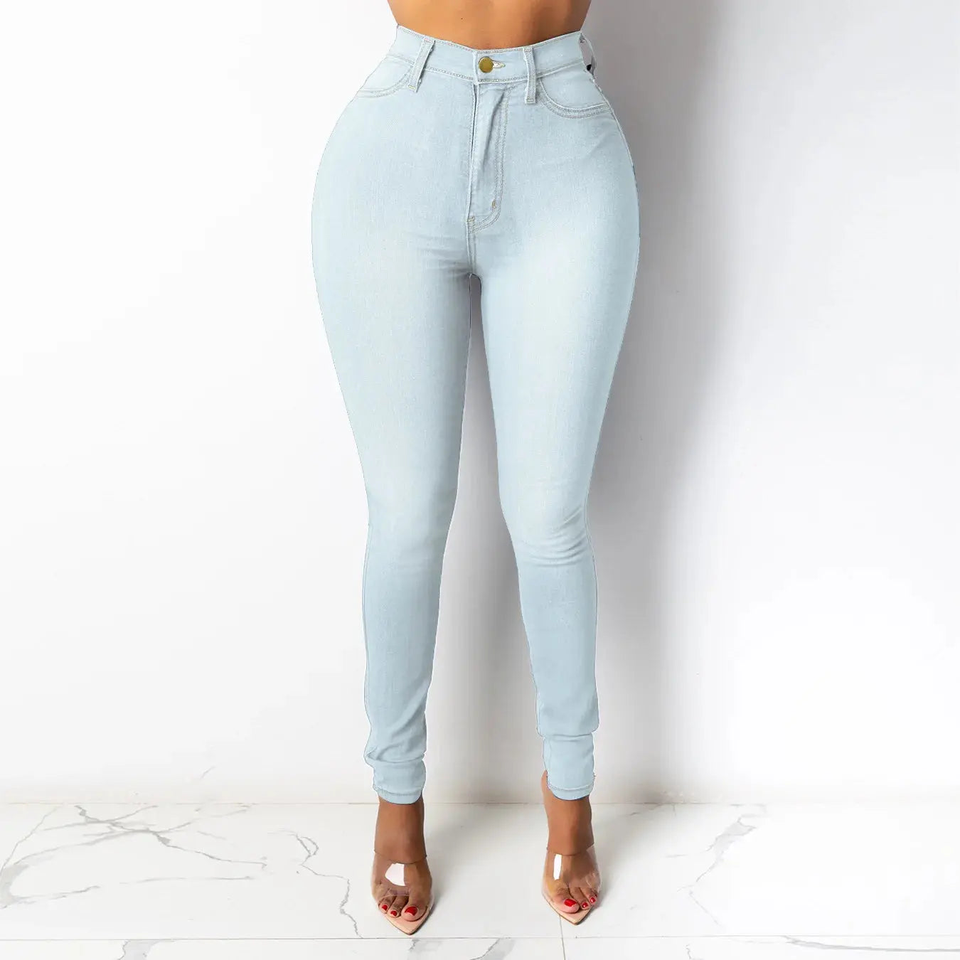 Model wearing high-waisted jeans, highlighting flattering fit and tailored waistline for a polished look.