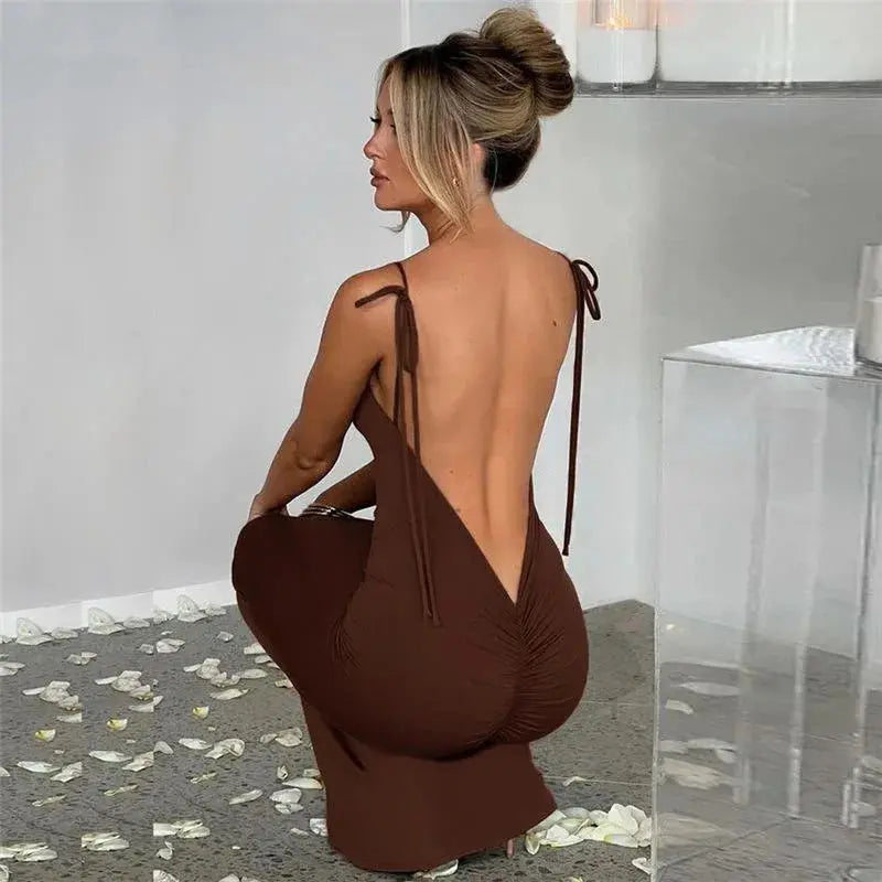 Midnight Whisper dress in black, featuring a backless design and spaghetti straps.