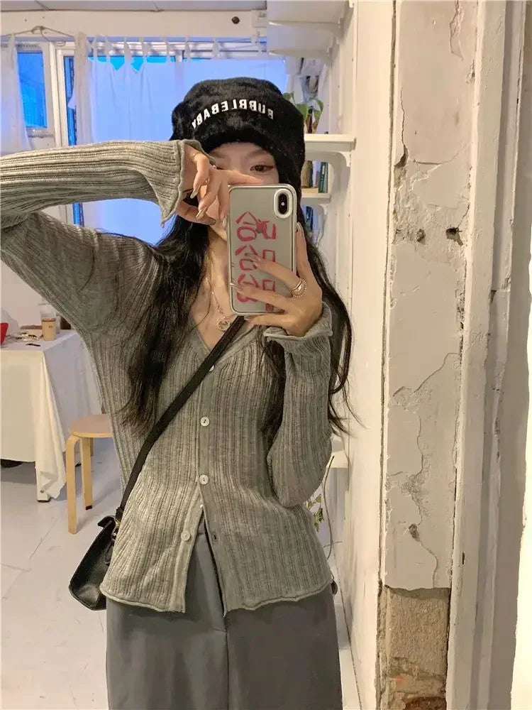 Model wearing the neutral-toned Autumn Whisper Cardigan, styled for casual chic.