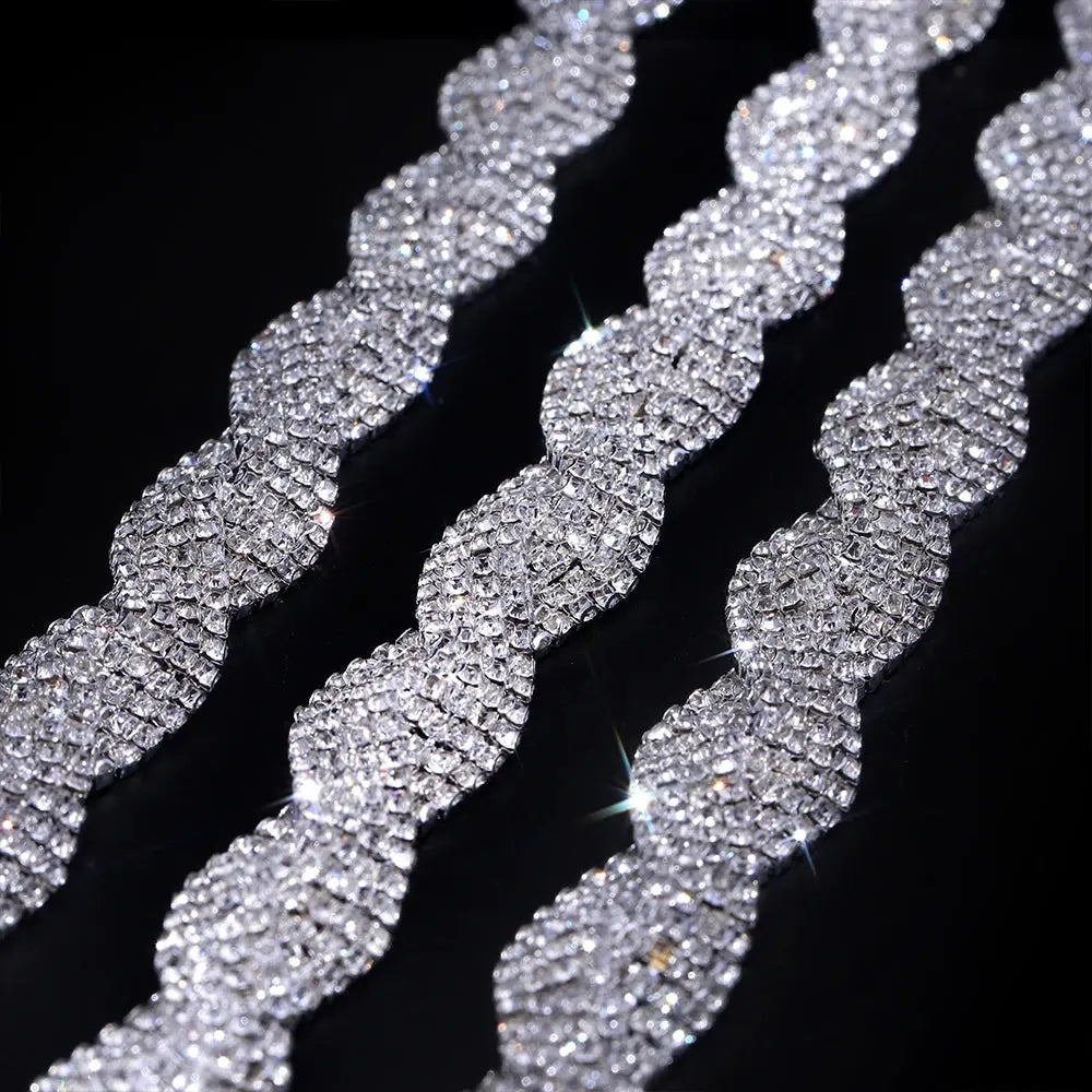 Durable glass rhinestones on silver chain, enhancing wedding dresses and party decor.