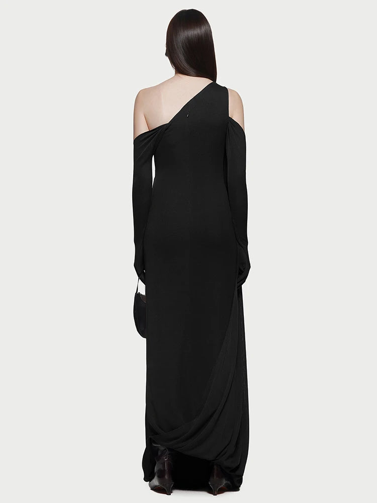 Back view of the evening dress highlighting the unique diagonal neckline.