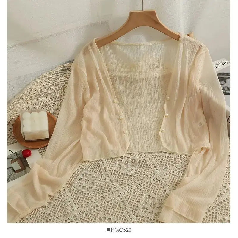 Summer Breeze Cardigan folded neatly, showcasing its lightweight knit material.