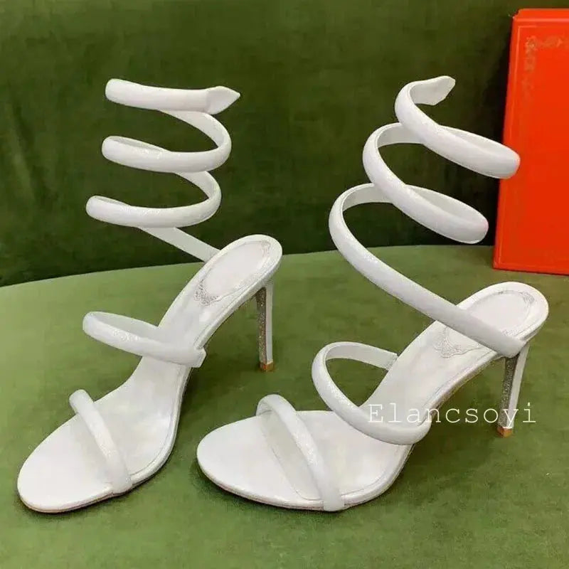 Detailed view of the snake-shaped ankle wrap on the heels.