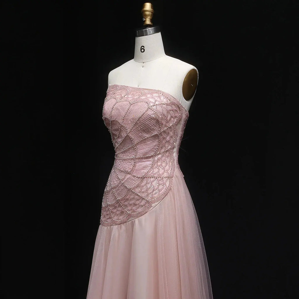 Flowing A-line silhouette of the gown showcasing a flattering natural waistline.