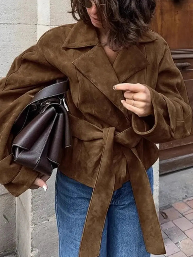 Close-up of plush matte fleece texture on the French suede jacket, showcasing luxury and warmth.