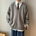 Elegant white cardigan, a versatile staple for men's winter fashion.