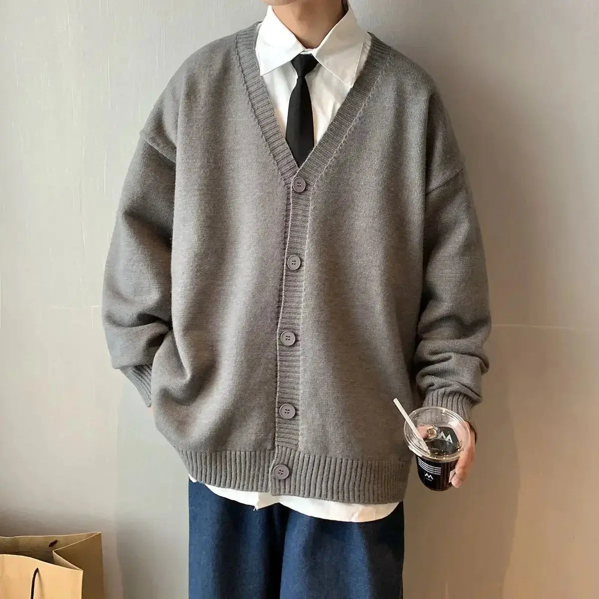 Elegant white cardigan, a versatile staple for men's winter fashion.