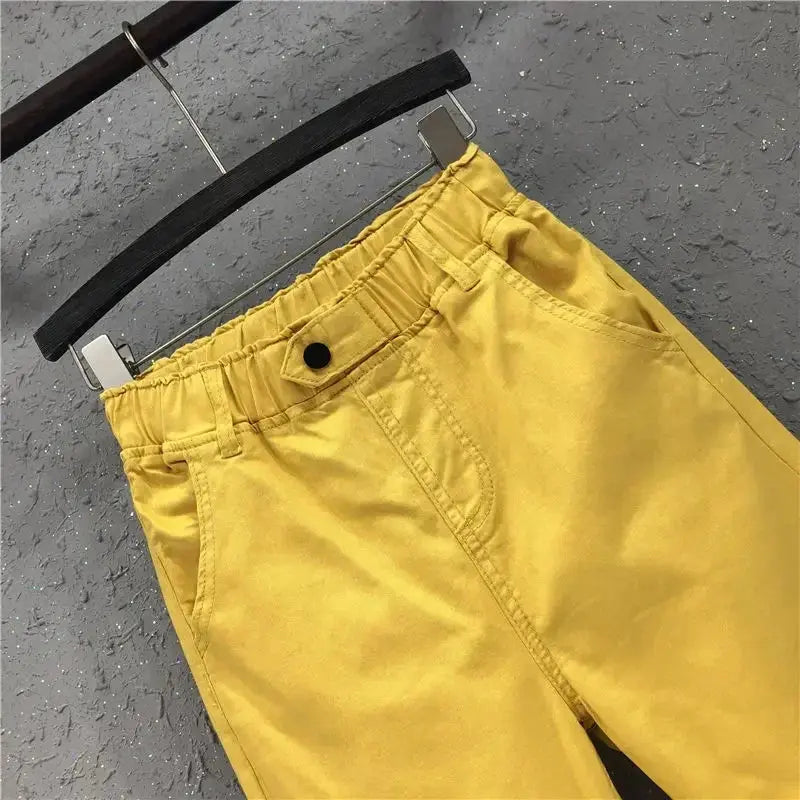 Close-up of the elastic waistband on Whisper-Soft Denim for a comfortable fit.