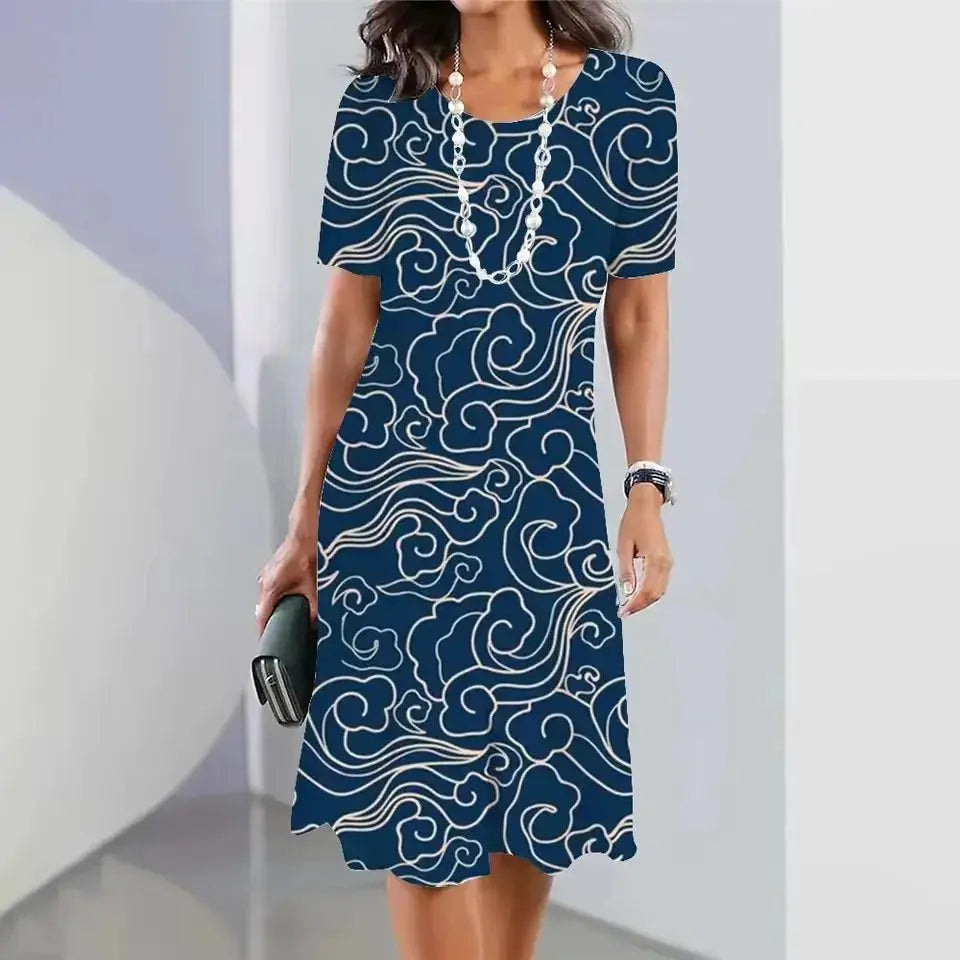 Model wearing the Summer Breeze Midi Dress, enjoying a sunny day at the beach.