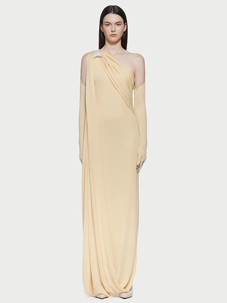 Side view of the asymmetrical dress emphasizing its modern elegance.