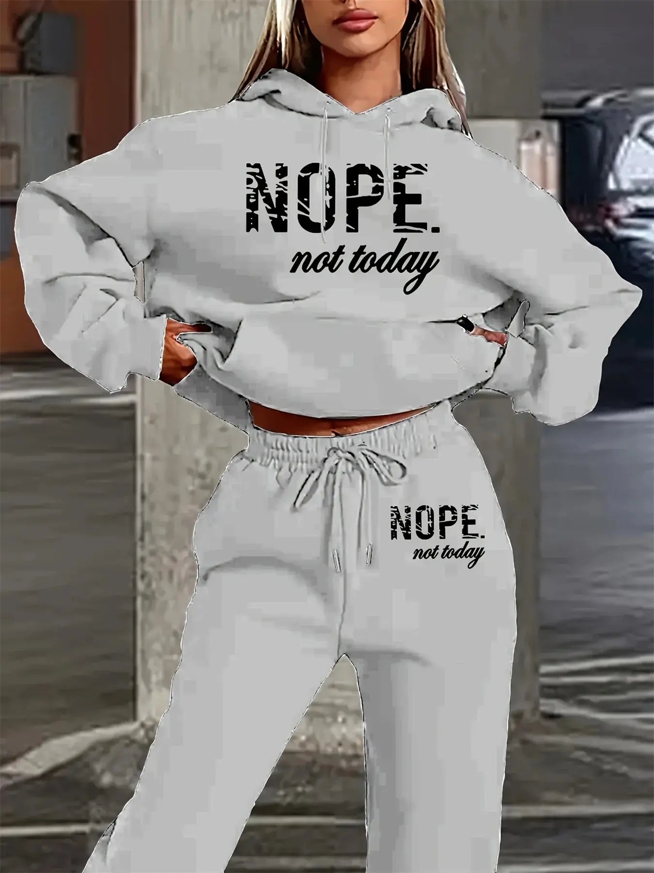 Relaxed fit pullover hoodie with NOPE Not Today lettering paired with coordinating jogger pants