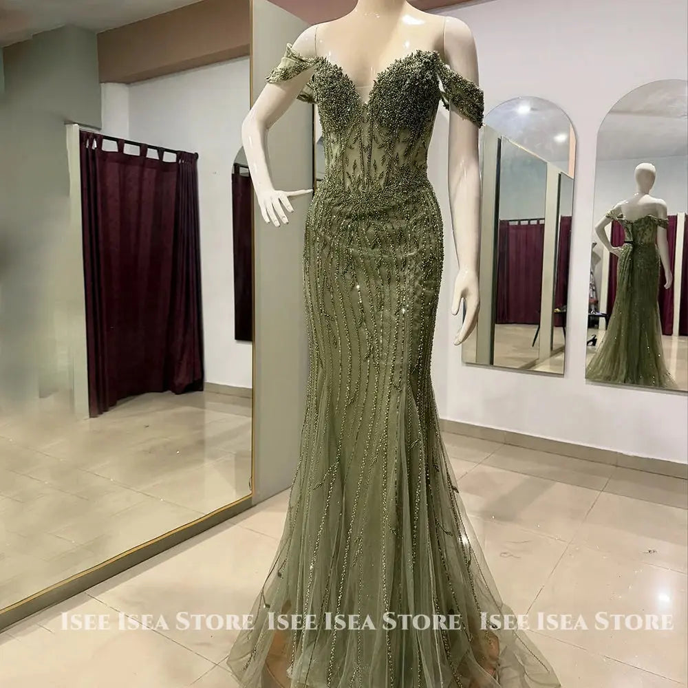 Close-up of lace appliques on the green Enchanting Gala Gown, showcasing exquisite detail.