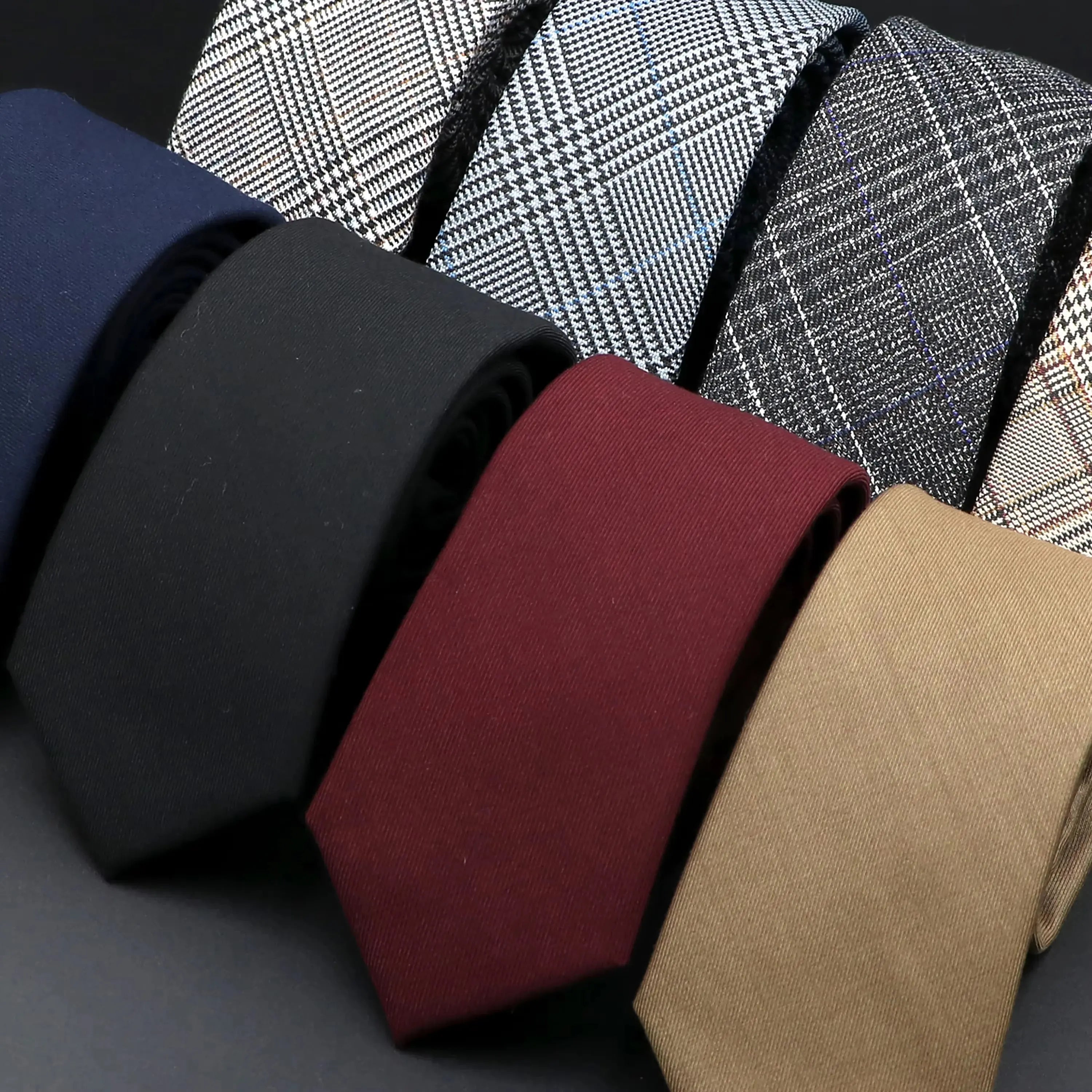 Sleek black tie made from premium cotton, perfect for formal occasions.
