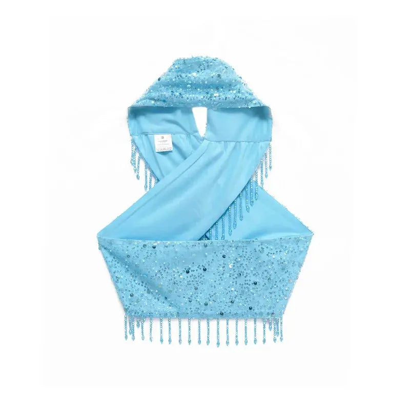Model wearing the Pearl Fringe Halter, highlighting graceful movement and stylish silhouette.