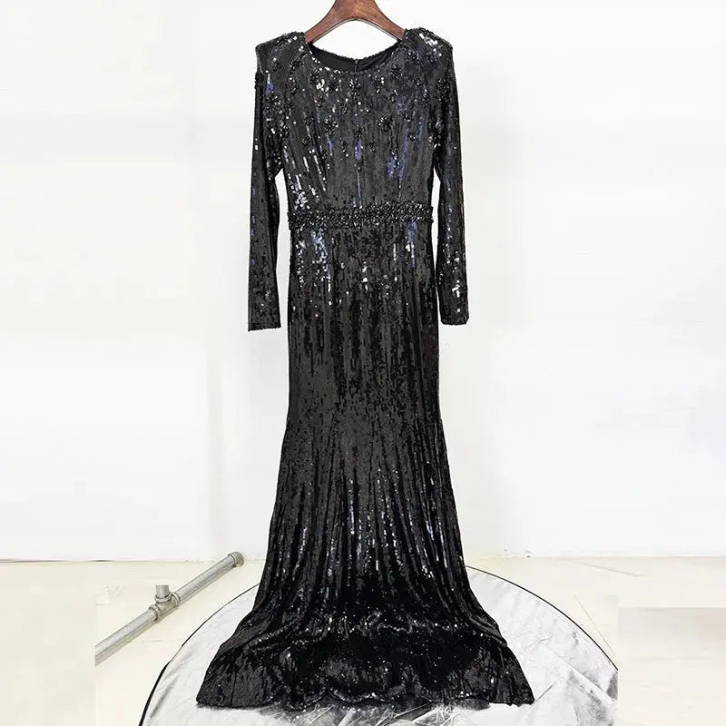 Side view of the sequined gown, illustrating the delicate play of light and shimmer.