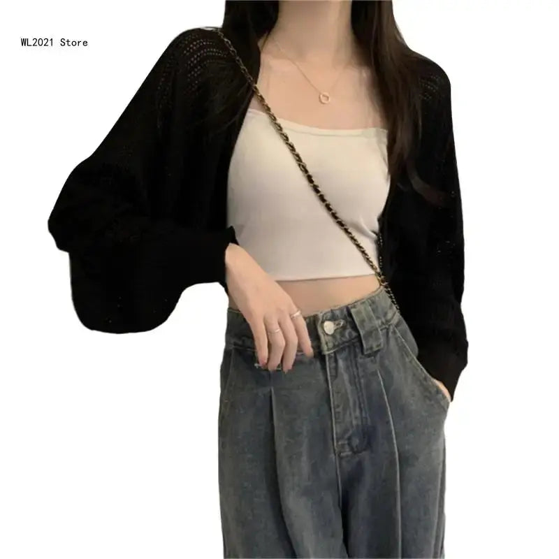 Stylish charcoal cropped cardigan with a chic silhouette, perfect for modern fashion lovers.