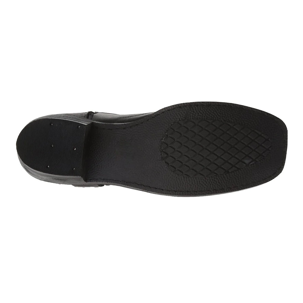 Close-up of riveted detailing on black riding boots, symbolizing strength and fortitude.