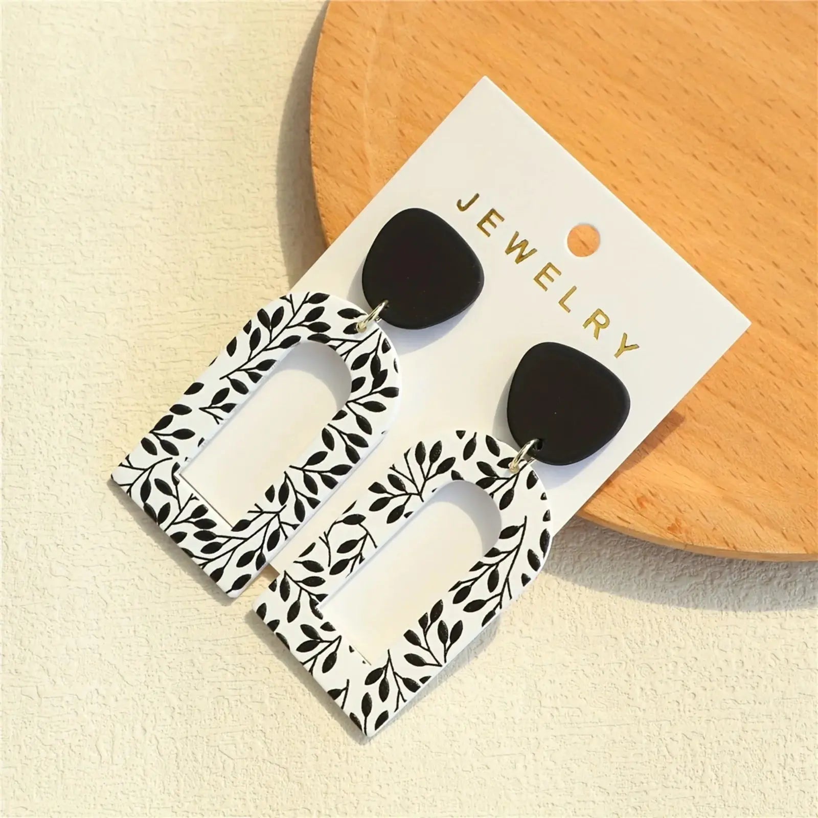 Whispering Leaves Drop Earrings displayed on a soft background, emphasizing their timeless and sophisticated design.