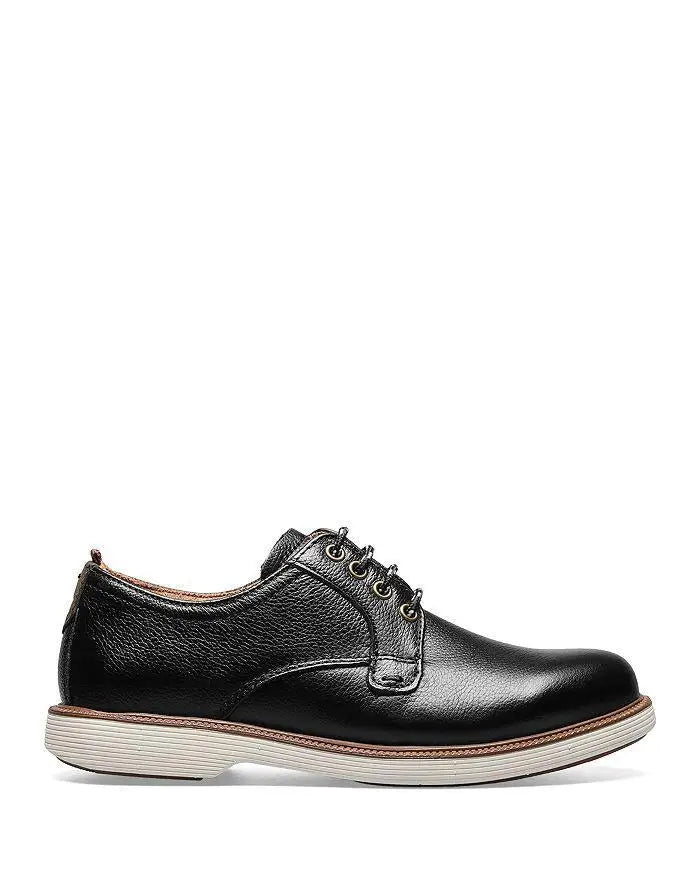 Detailed view of cognac oxford footwear with advanced breathable materials and cushioned insole