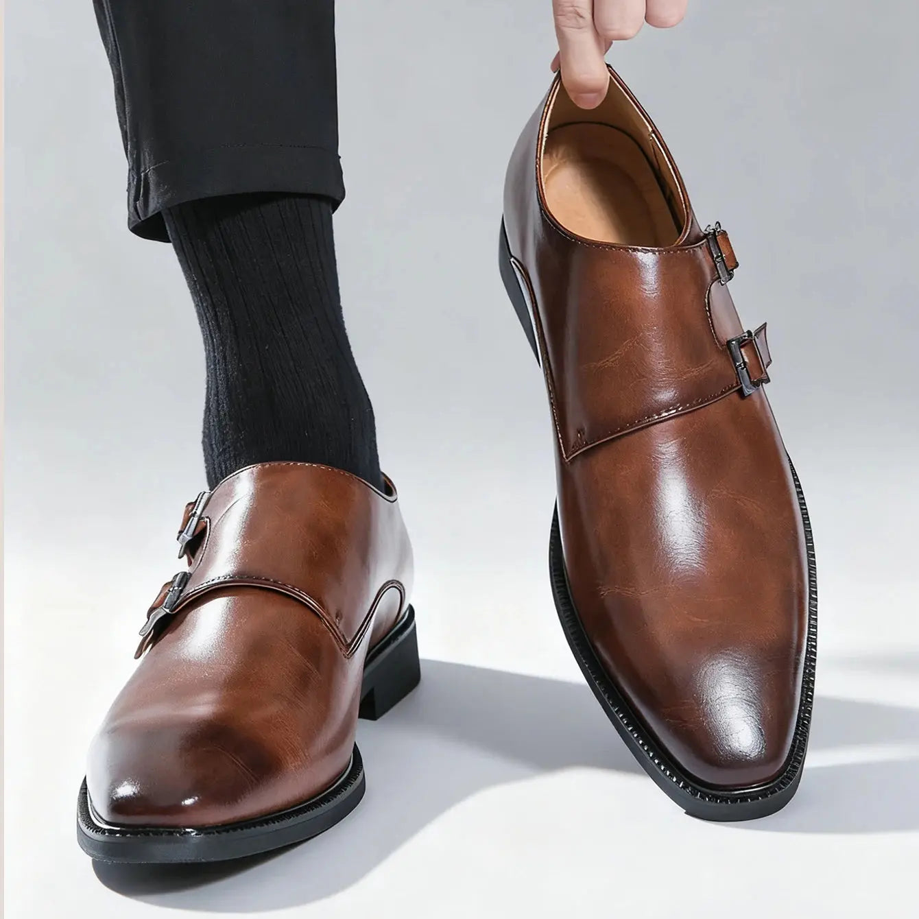 Side view of the monk strap shoes highlighting the elegant silhouette and buckle detail.