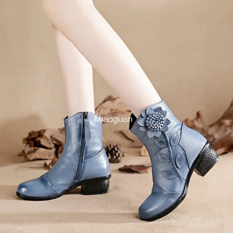 Mid-calf boots with romantic floral design, side zip closure, and cushioned insole