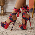 Red Skyline Heels with peep toe design, perfect for commanding attention at galas.