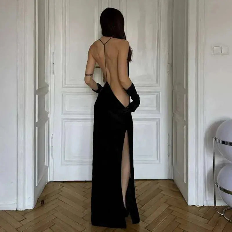 Model wearing the backless Captivate the Night dress, highlighting the dramatic side split.