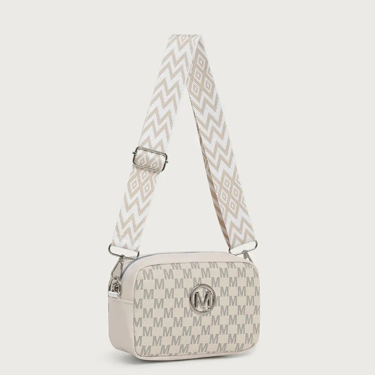 Chic crossbody bag in black PU with distinctive M pattern and wide adjustable strap.