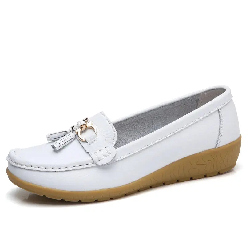 Chic slip-on sneakers in white, perfect for busy mornings.