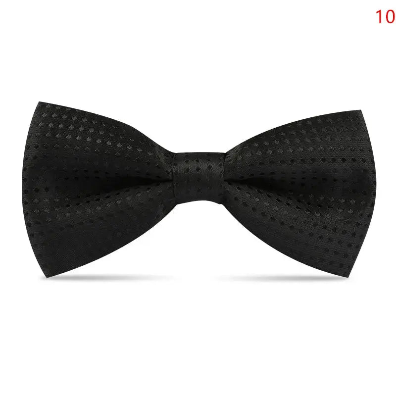 Black bow tie draped over a suit jacket, showcasing its transformative fashion appeal.
