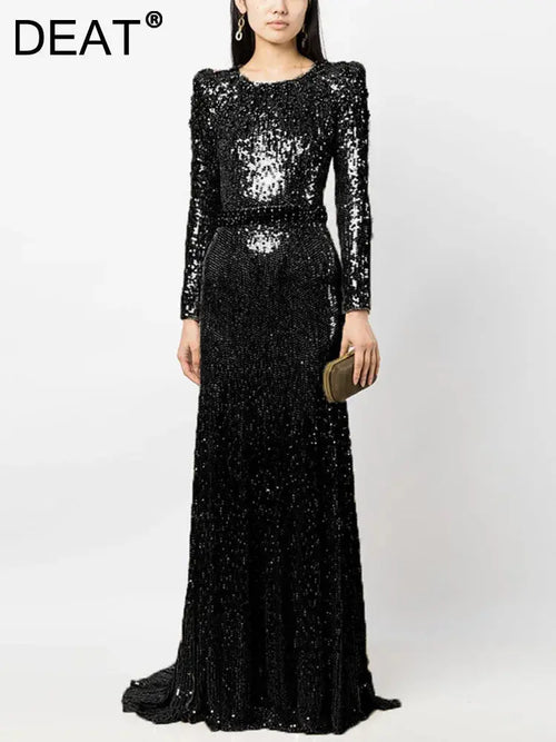 Elegant floor-length sequined gown in deep navy, perfect for evening elegance.