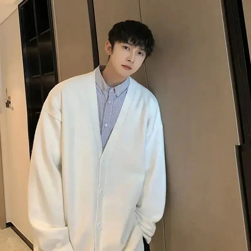 White V-neck cardigan made from cotton-polyester blend for winter elegance.