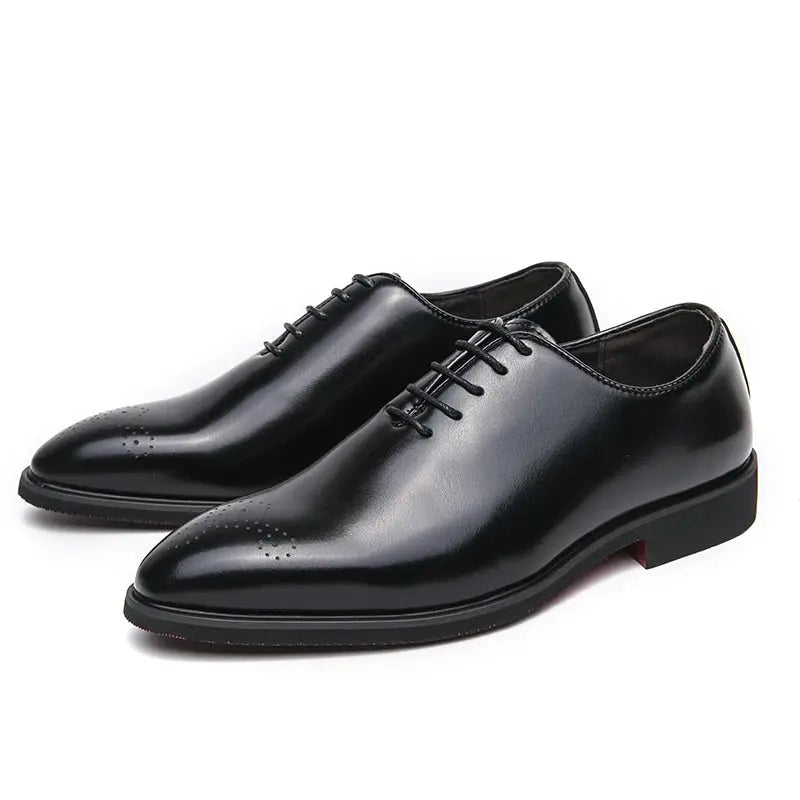 Close-up of hand-stitched lines on premium split leather oxfords.