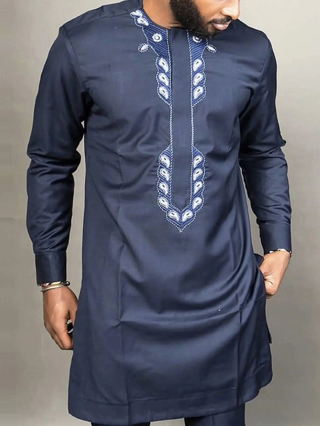 Vibrant Nigerian Kaftan Suit showcasing intricate patterns and luxurious fabric.