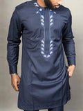Vibrant Nigerian Kaftan Suit showcasing intricate patterns and luxurious fabric.