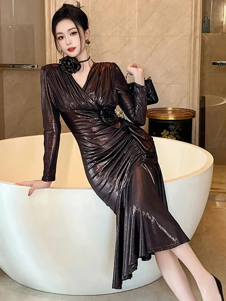 Midnight Shimmer Dress displayed on a hanger, highlighting its luxurious polyester blend material.