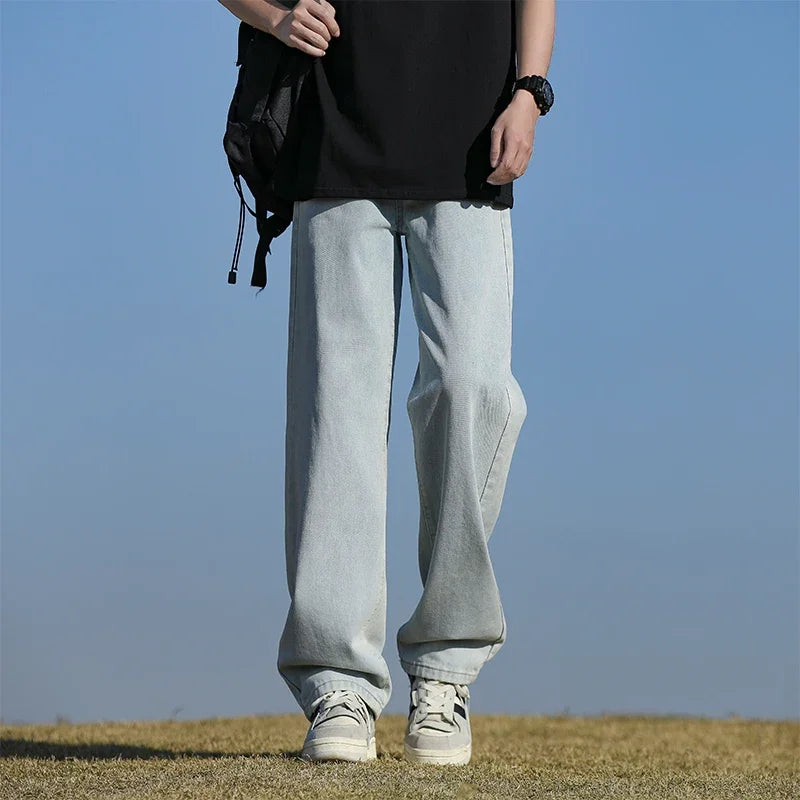 Model wearing Breathe Easy Jeans, showcasing effortless style in a casual city setting.