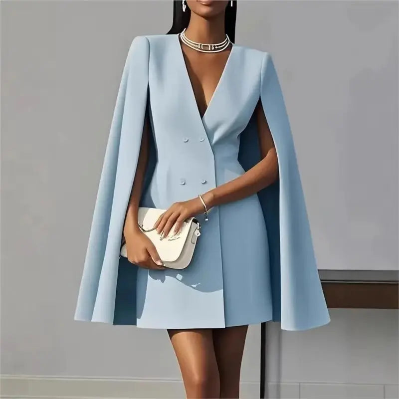 Model in a stylish pose wearing the V-neck cloak blazer, emphasizing its commanding design.