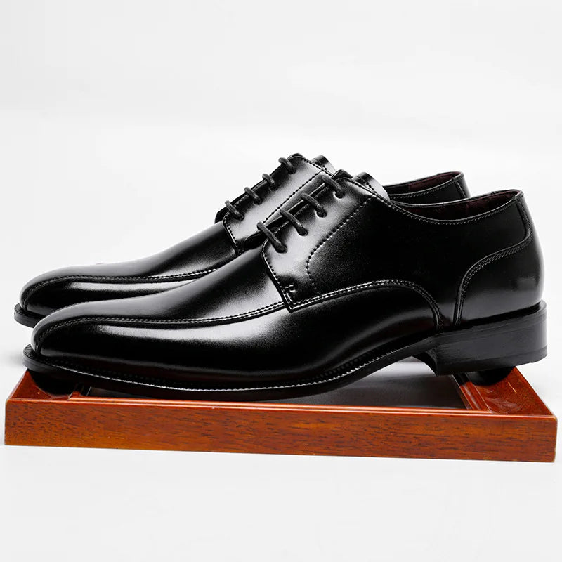 Durable rubber soles of refined leather dress shoes for confident walking.