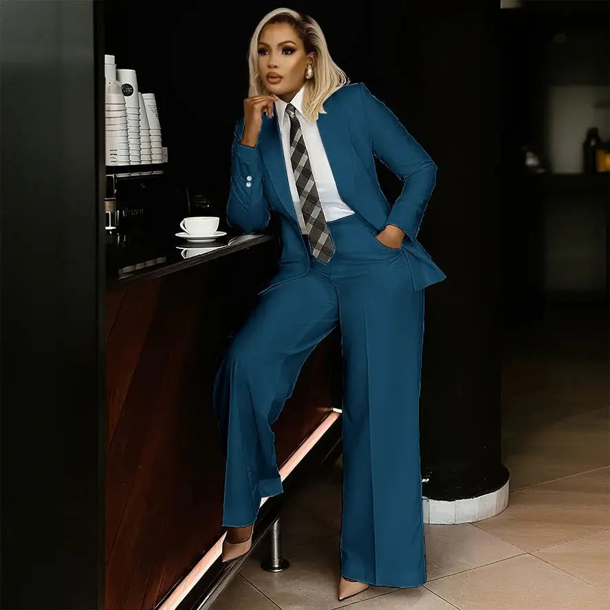 Side view of the slim-fit white suit pants paired with a blazer.