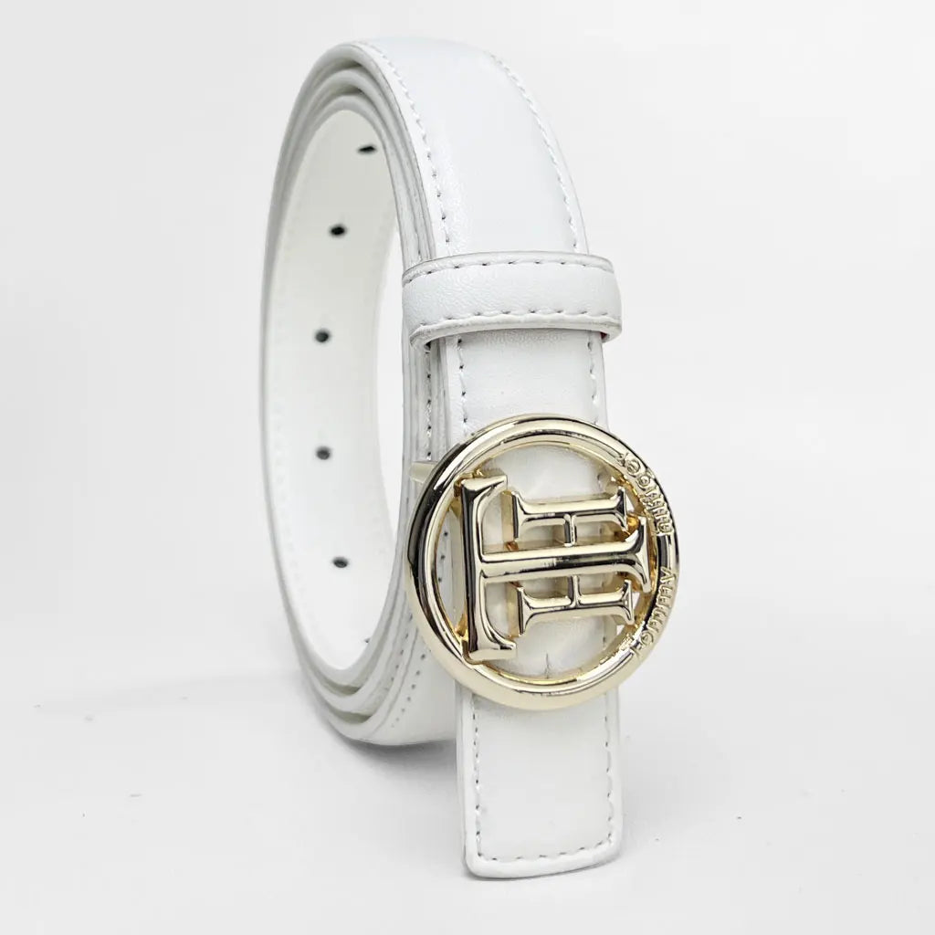 Smooth faux leather belt adding refinement to casual jeans.