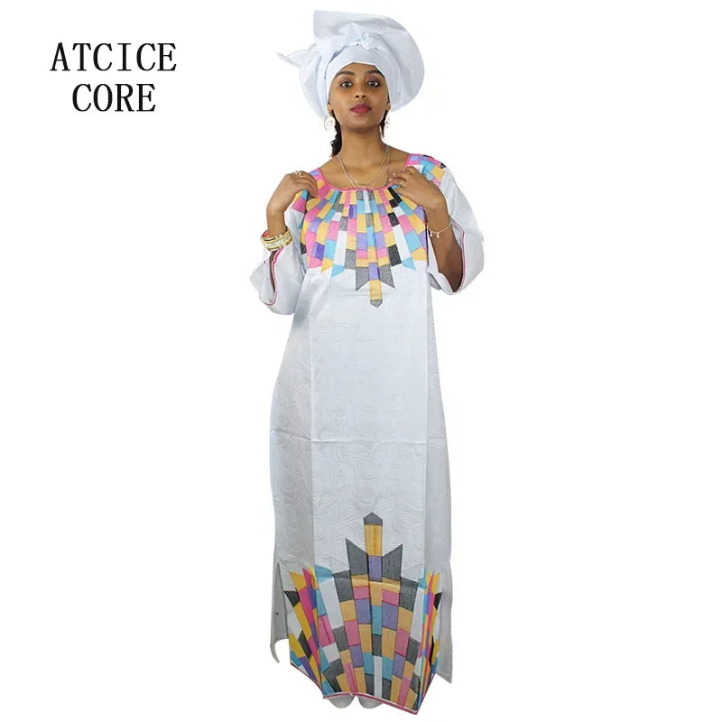 Vibrant embroidered cotton Bazin Riche dress for women, perfect for weddings and cultural celebrations